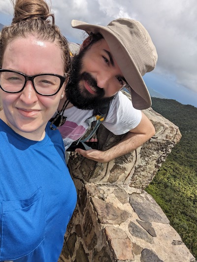 Ariele & Stephen smiling at the top of an observation point at the end of an hour long hike in El Yunque National Forest